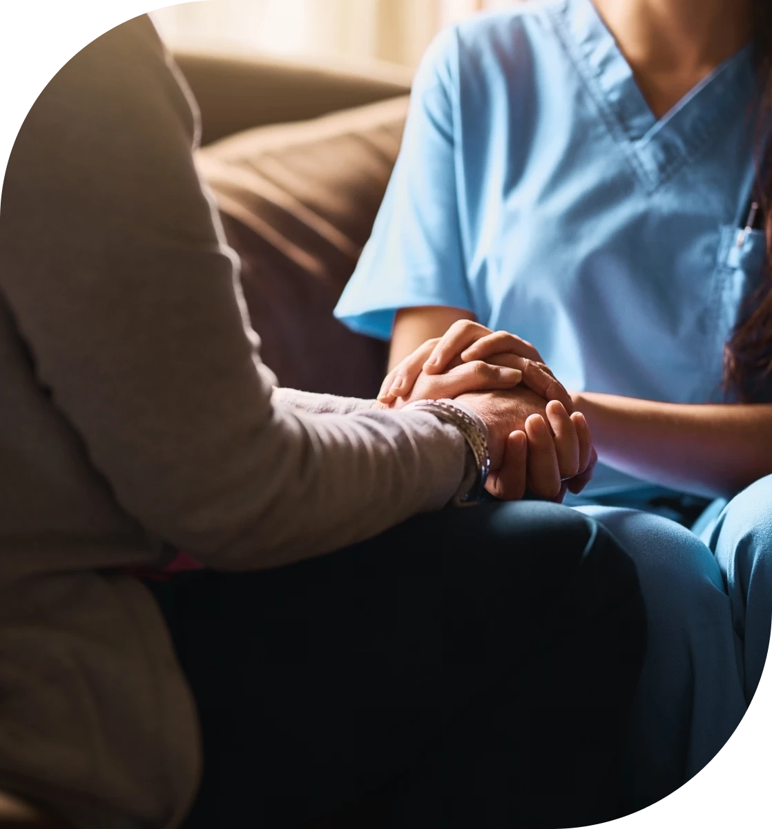 Healthcare worker comforting a patient