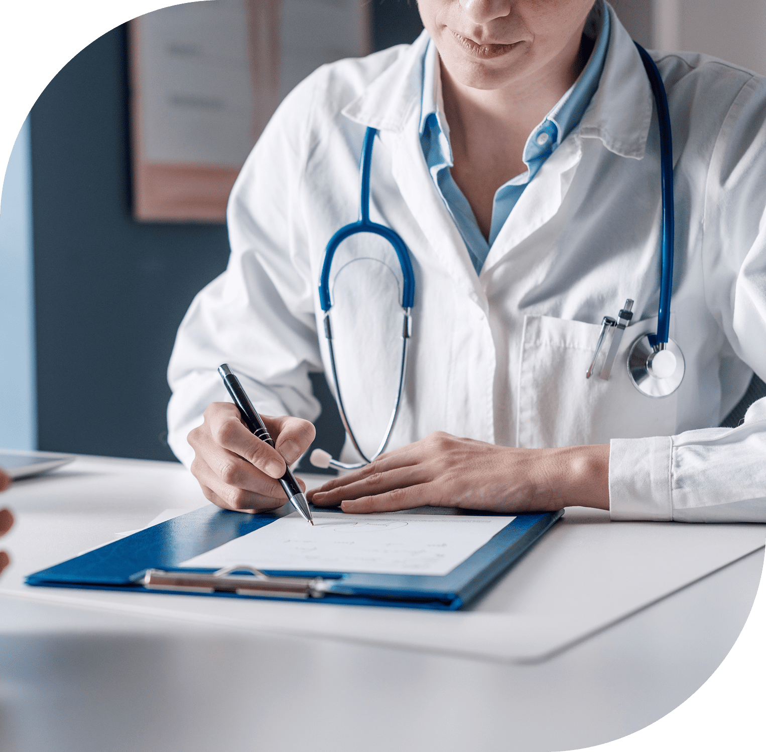Doctor writing notes on clipboard
